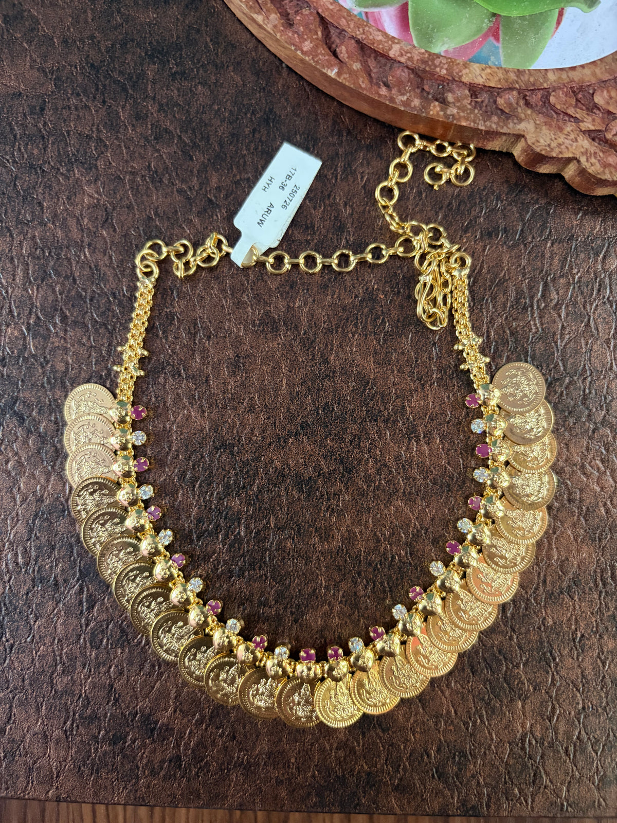 Impon coin necklace with ruby and white stone