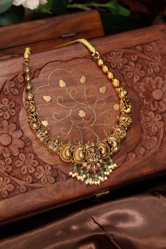 Antique neclace with lakshmi mottif along with rice pearls