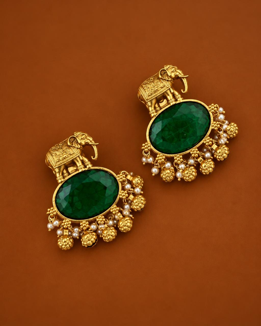 Bold emerald stone elephant earrings